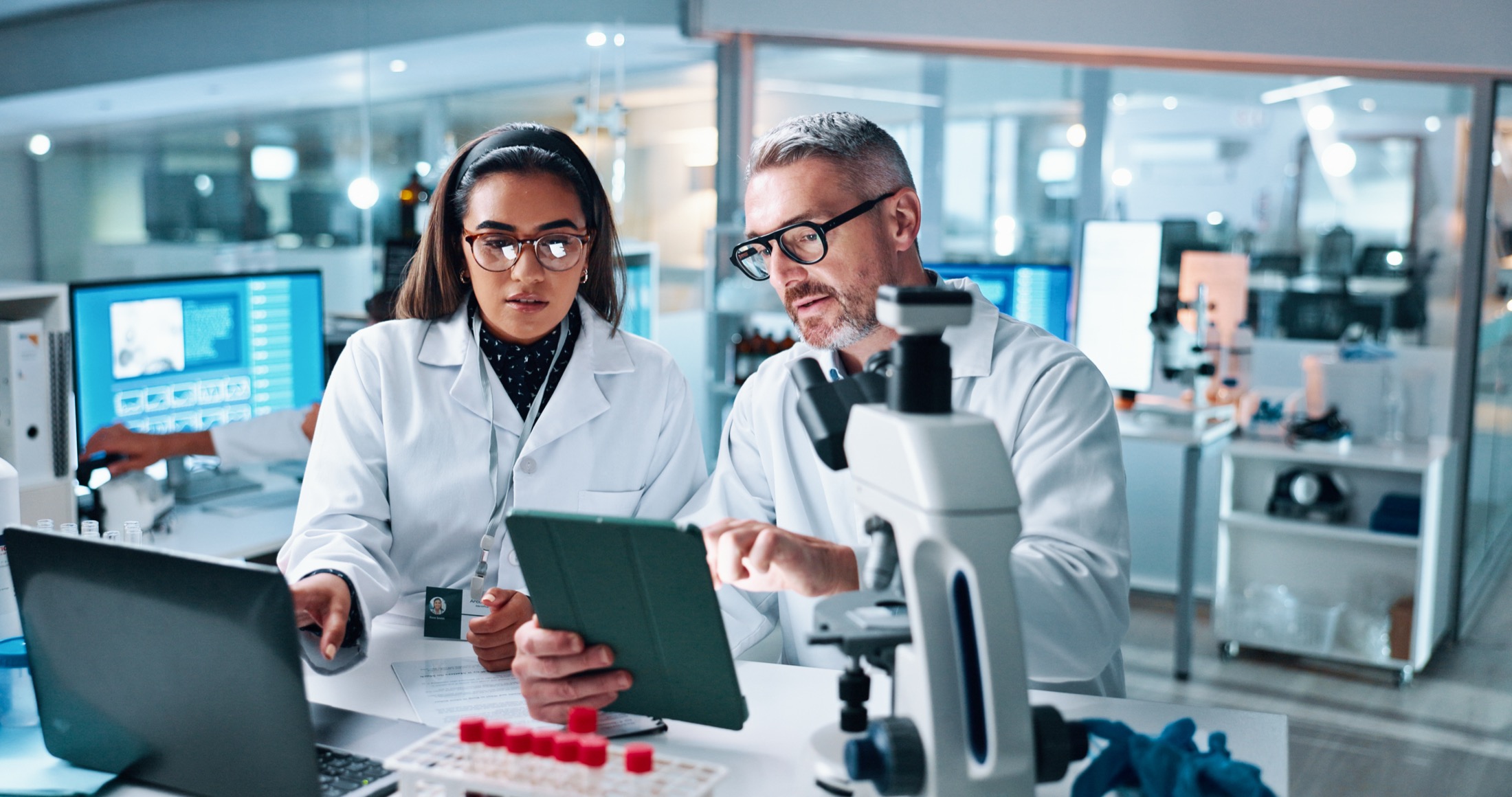 Laboratory researchers reviewing analytical results together
